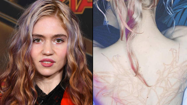 Grimes dévoile un énorme nouveau tatouage dans le dos « cicatrices extraterrestres » 2 Grimes dévoile un énorme nouveau tatouage dans le dos « cicatrices extraterrestres » - 1