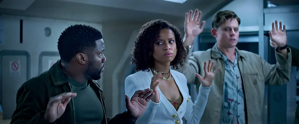 Soulevez le film Netflix Kevin Hart dans le rôle de Cyrus Gugu Mbatha Raw dans le rôle d'Abby et Billy Magnussen dans le rôle de Magnus Soulevez le film Netflix Kevin Hart dans le rôle de Cyrus Gugu Mbatha Raw dans le rôle d'Abby et Billy Magnussen dans le rôle de Magnus